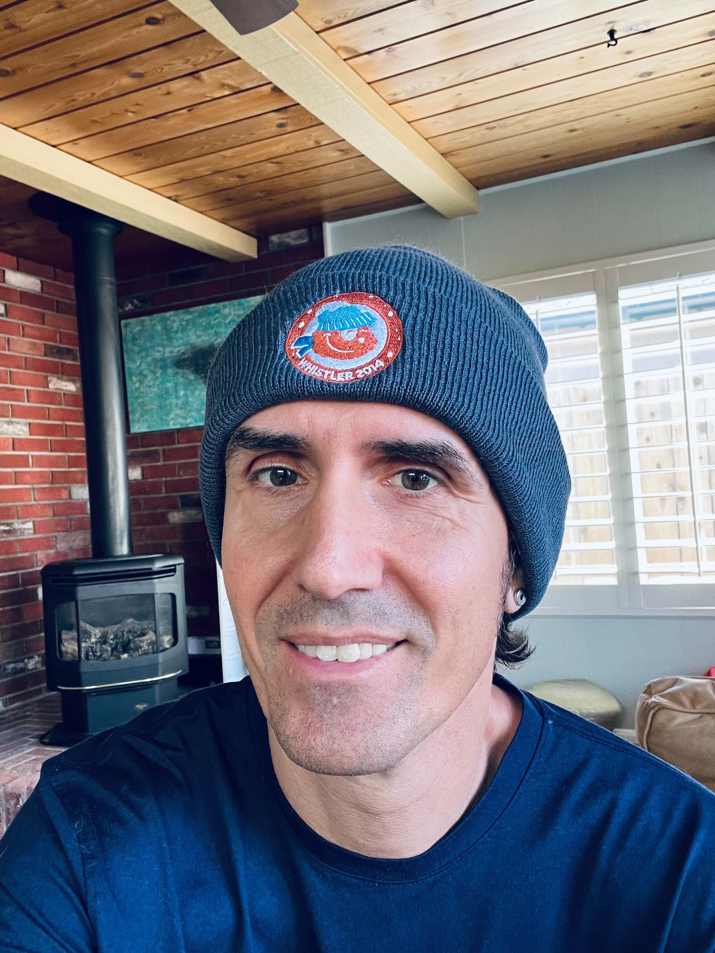 Will Hutchinson wearing a blue beanie for Blue Beanie Day 2025